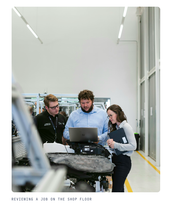 DGF Engineering team reviewing a job on the shop floor