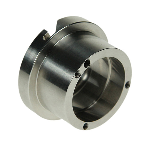 Stainless steel bearing housing with cross-drilled ports